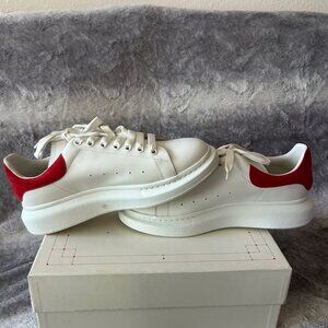 White Sneakers with Red Accents